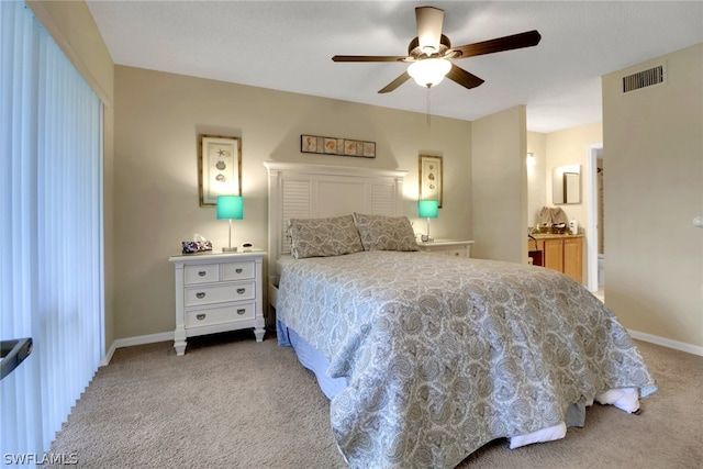 bedroom featuring ceiling fan and light carpet