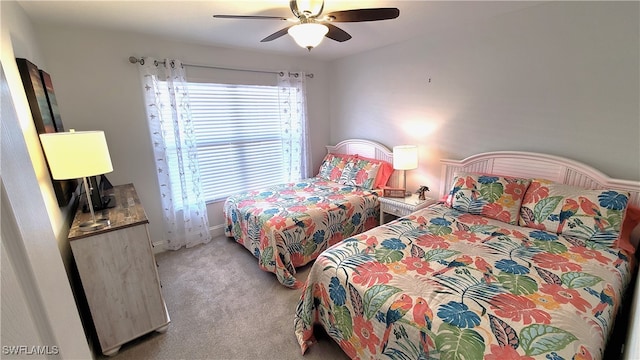 bedroom featuring carpet flooring, multiple windows, and ceiling fan