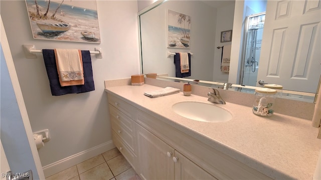 bathroom with tile patterned floors and vanity