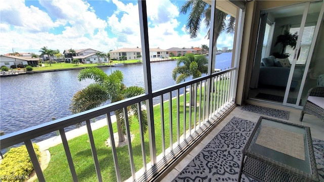 balcony featuring a water view