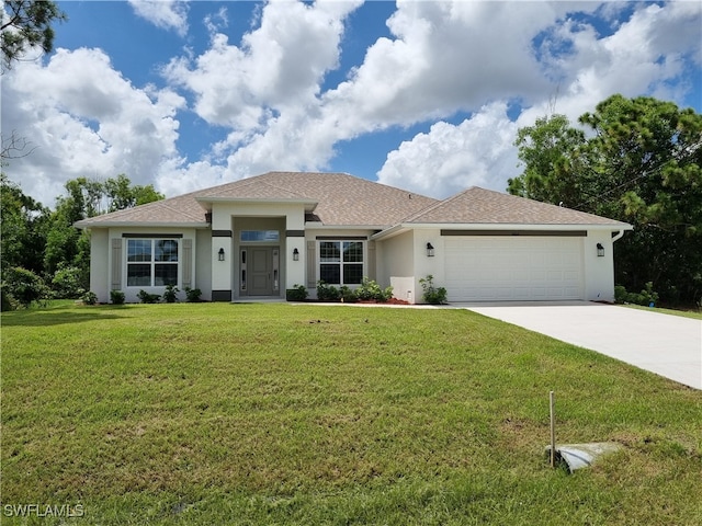 view of front of home with a garage and a front lawn