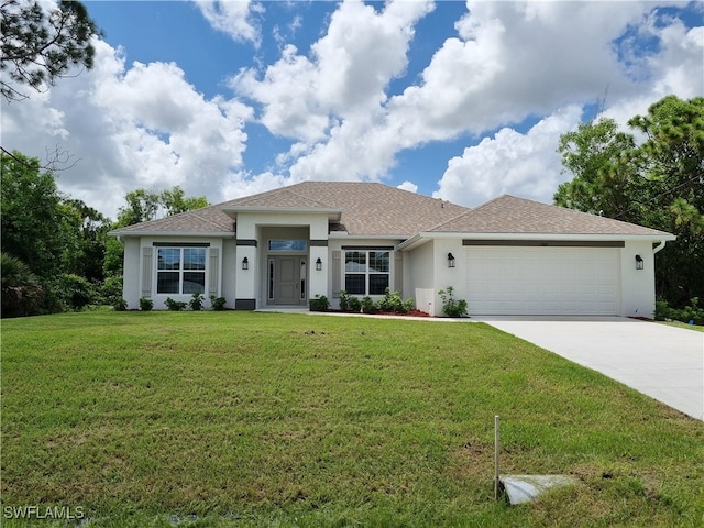 view of front facade featuring a garage and a front lawn