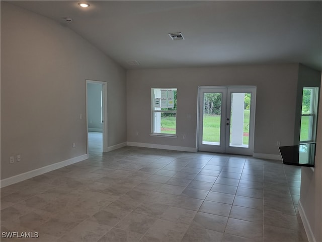 interior space with lofted ceiling and french doors