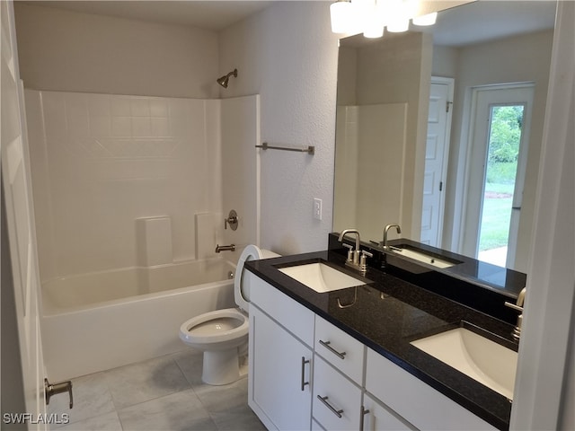 full bathroom featuring vanity, toilet, tile patterned floors, and shower / washtub combination