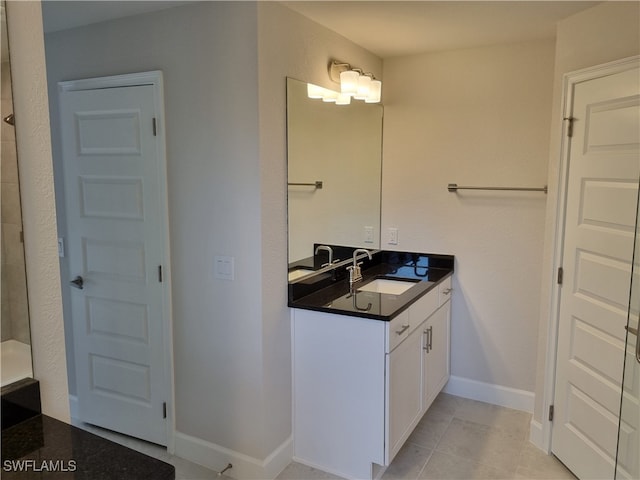 bathroom featuring tile patterned floors and vanity