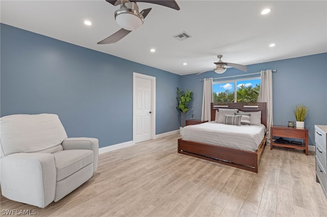 bedroom with ceiling fan and light wood-type flooring