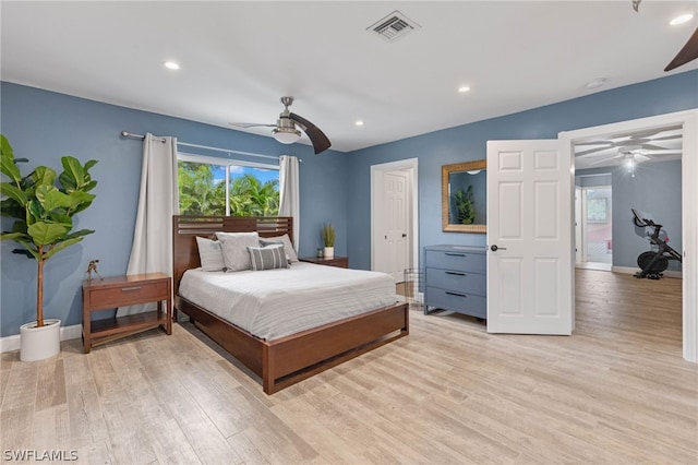 bedroom with ceiling fan and light hardwood / wood-style flooring