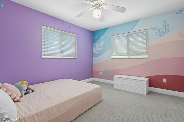 bedroom featuring ceiling fan and light colored carpet