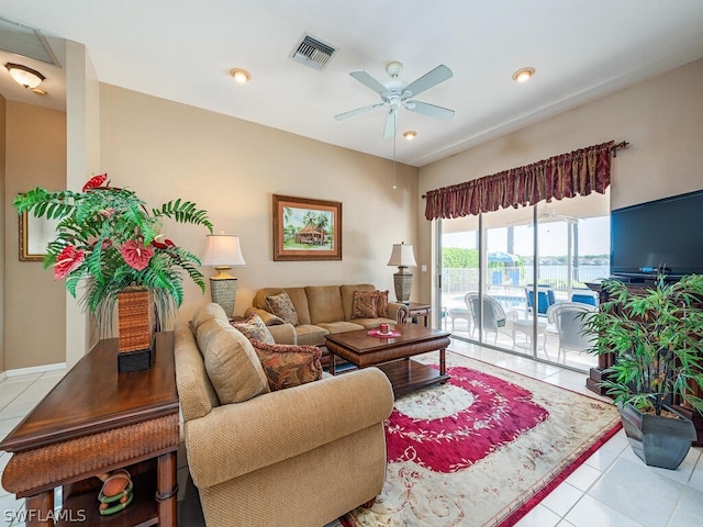 living room with ceiling fan and light tile floors