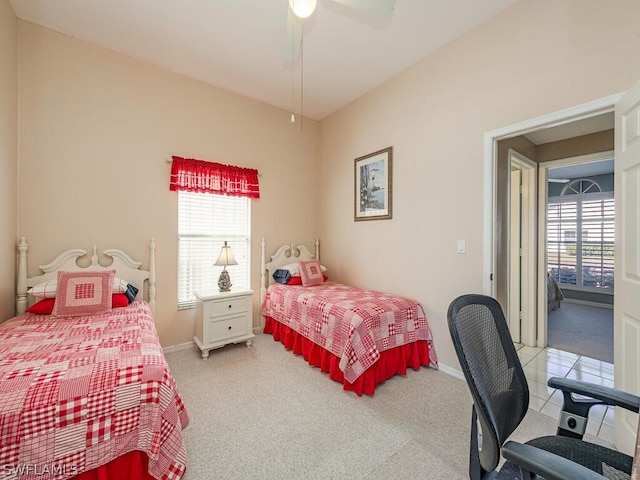 bedroom with light carpet, multiple windows, and ceiling fan