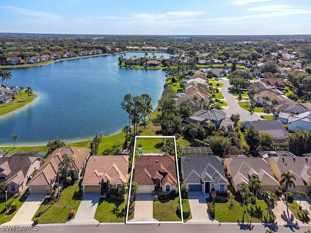 birds eye view of property with a water view