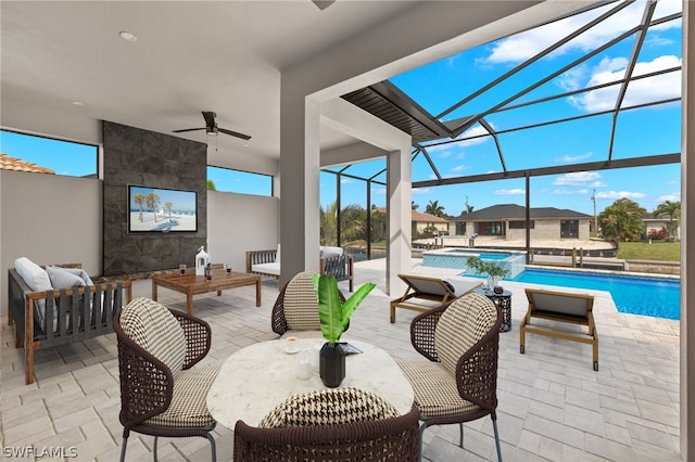 sunroom featuring ceiling fan