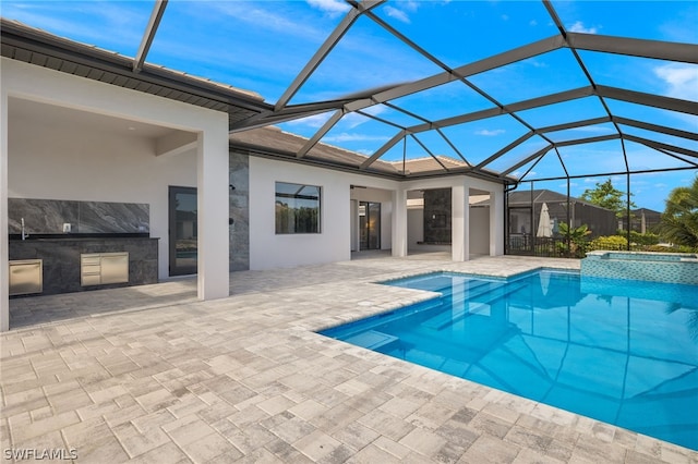 view of pool with a lanai and a patio