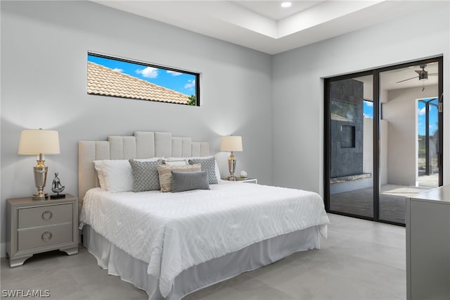 tiled bedroom featuring multiple windows and access to exterior