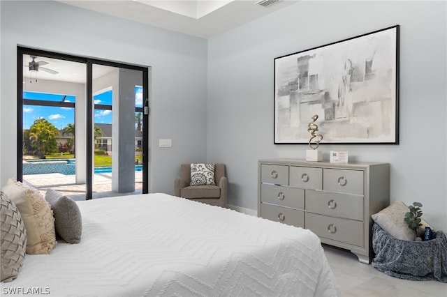 bedroom featuring light tile floors and access to exterior