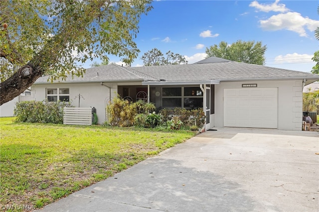 single story home with a front yard and a garage