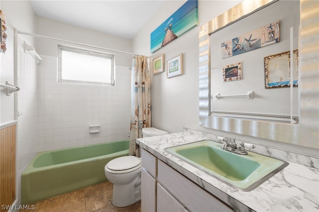 full bathroom with toilet, vanity with extensive cabinet space, shower / tub combo with curtain, and tile flooring