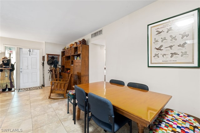 dining area with light tile floors