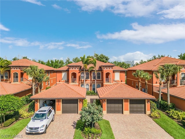 mediterranean / spanish house featuring a garage