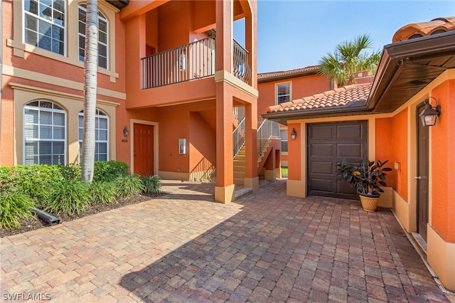 doorway to property featuring a garage