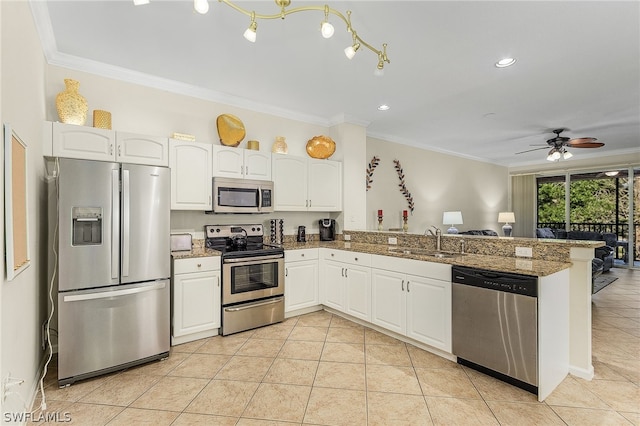 kitchen with kitchen peninsula, ceiling fan, sink, white cabinets, and stainless steel appliances