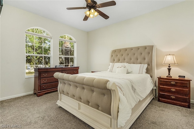 bedroom featuring light carpet and ceiling fan