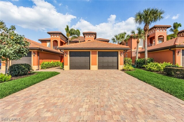 mediterranean / spanish-style home featuring a garage