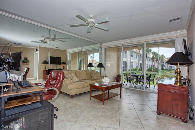 living room with crown molding, light tile patterned floors, and ceiling fan