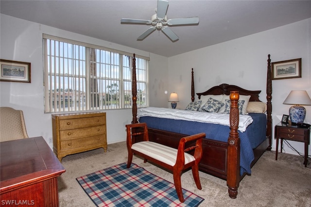 bedroom featuring ceiling fan and carpet