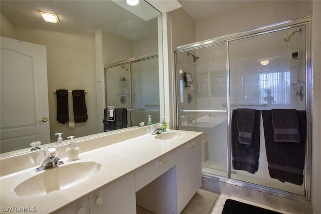 bathroom featuring vanity, an enclosed shower, and tile patterned floors