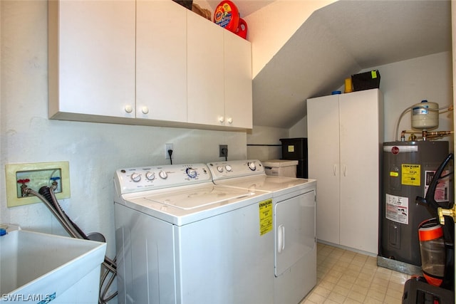 laundry room featuring cabinets, sink, electric water heater, and washer and dryer