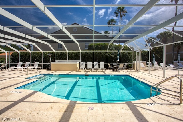 view of pool featuring a lanai and a patio area