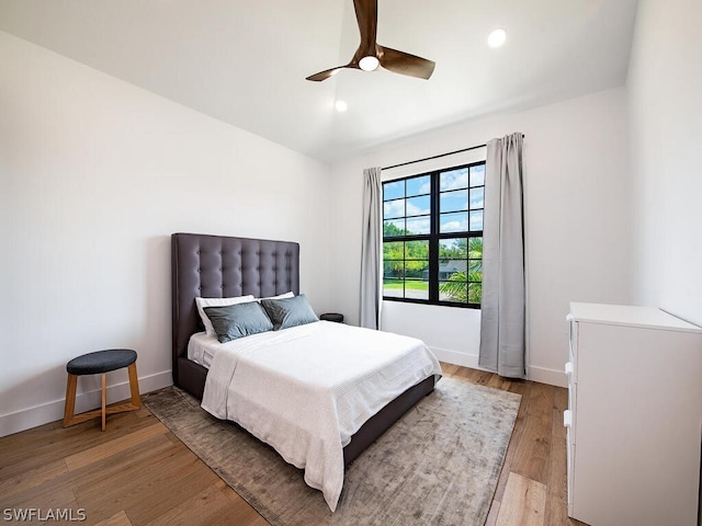 bedroom featuring ceiling fan and light hardwood / wood-style flooring