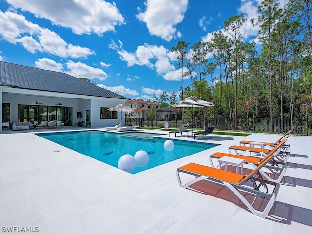 view of swimming pool featuring a patio