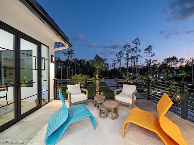 patio terrace at dusk with a balcony