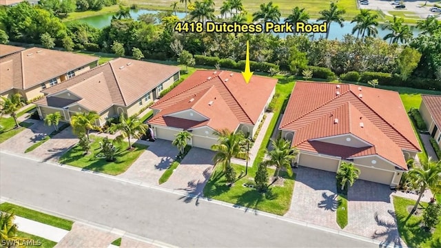 birds eye view of property featuring a water view