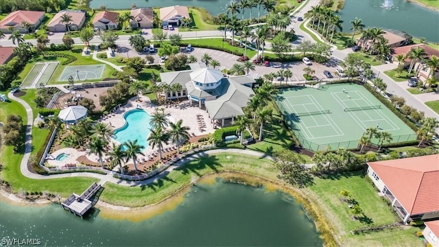 birds eye view of property with a water view