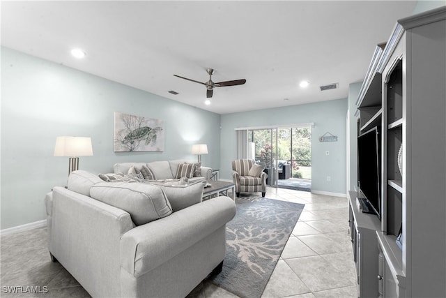 living room with ceiling fan and light tile patterned floors