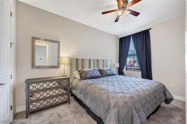 bedroom with light carpet and ceiling fan