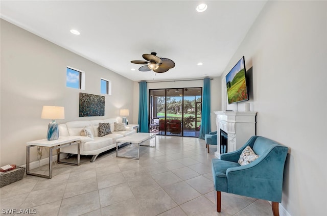 living room with light tile floors and ceiling fan