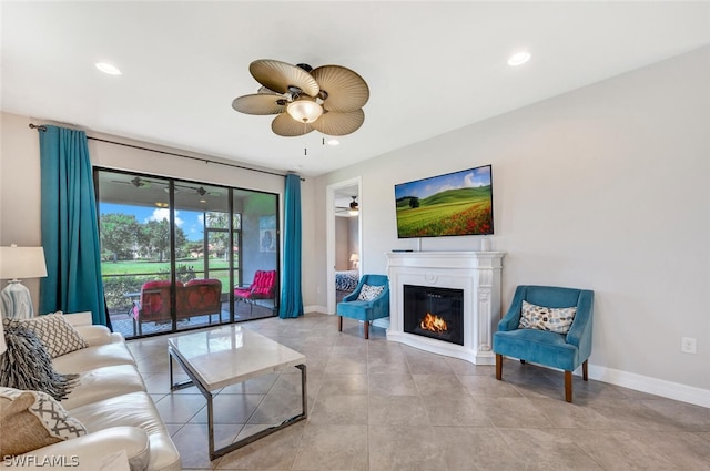 living room featuring light tile floors and ceiling fan