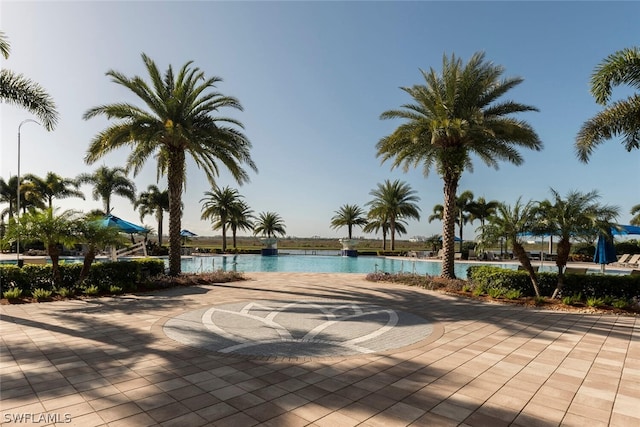 view of pool featuring a water view