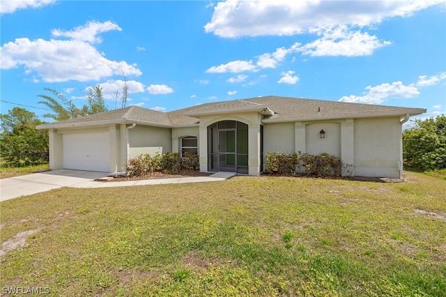 view of front of home featuring a garage and a front lawn