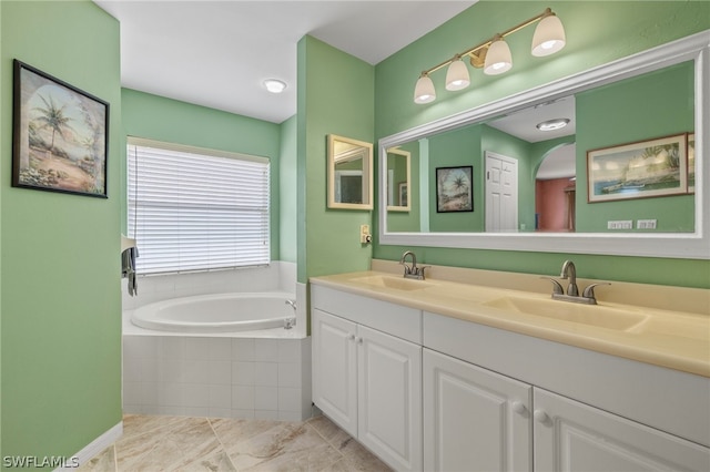 bathroom featuring tiled bath, tile flooring, and double vanity