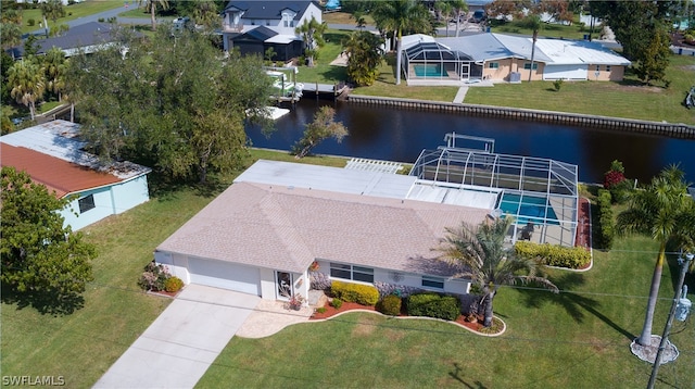 birds eye view of property with a water view