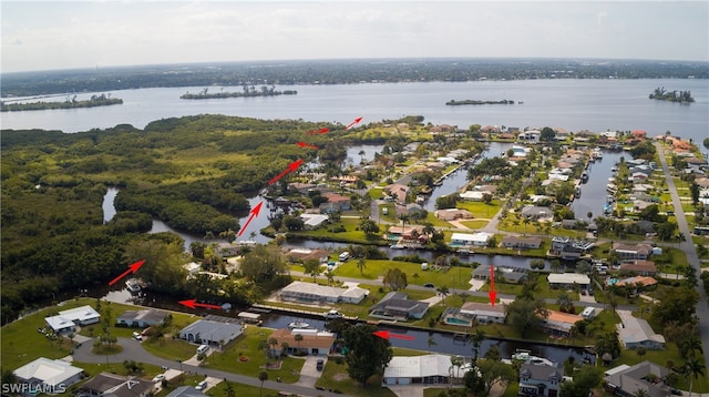 birds eye view of property featuring a water view