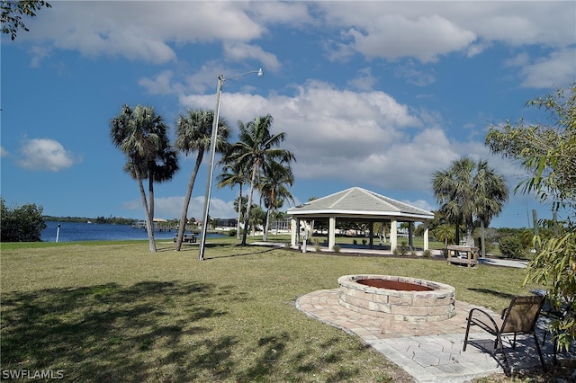 view of home's community featuring a lawn, a gazebo, and a water view