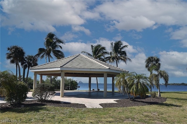 view of home's community featuring a water view, a gazebo, and a yard