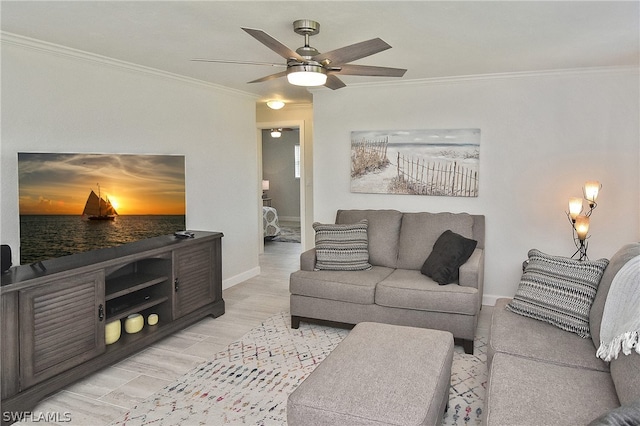 living room with crown molding, light hardwood / wood-style floors, and ceiling fan