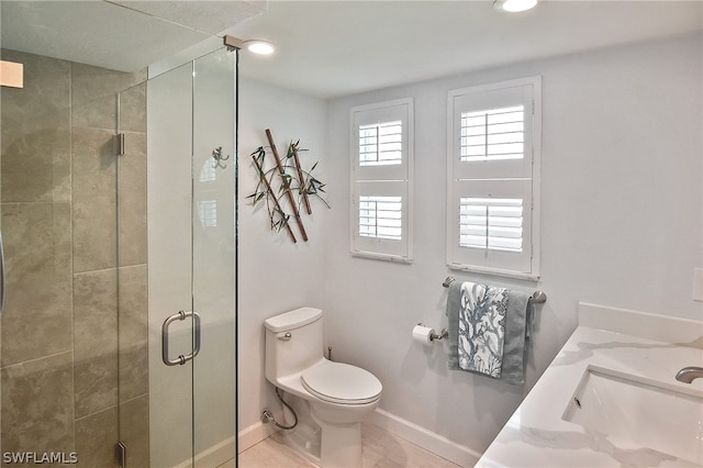 bathroom featuring vanity, tile floors, toilet, and an enclosed shower